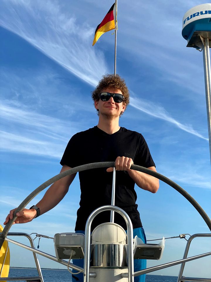 Fabian Off at the helm of a sailing boat